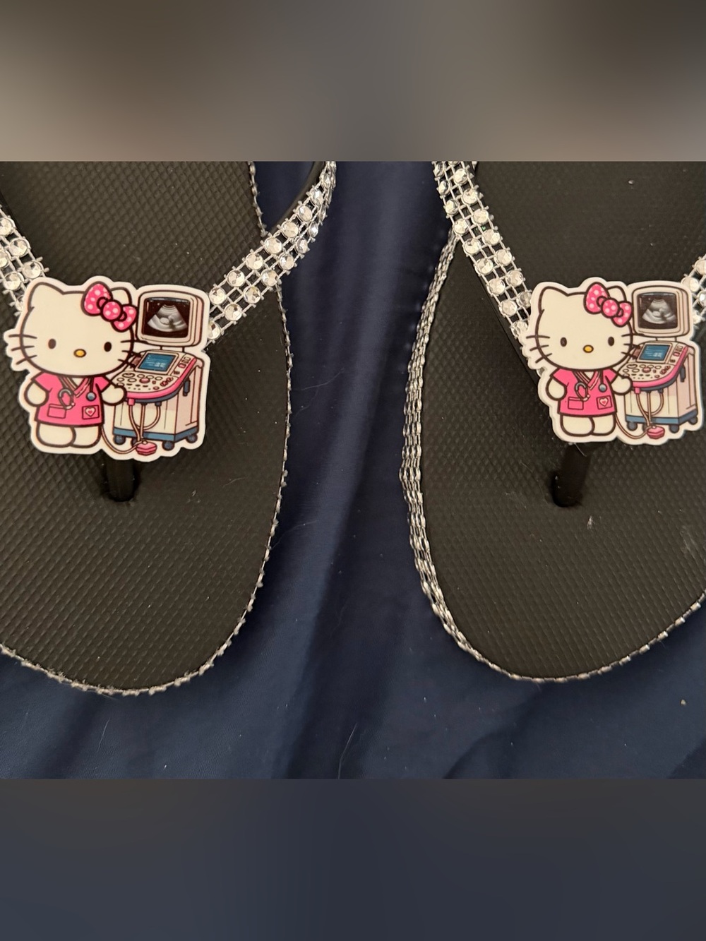 Hello Kitty Black Flip Flops with Pink Character Accents